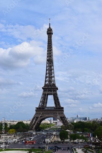 Fototapeta Naklejka Na Ścianę i Meble -  PARIS, FRANCE - APRIL 28, 2018: Beautiful view of the Eiffel Tower (Tour Eiffel) in a sunny spring day - Breathtaking view of the most known monument of Paris