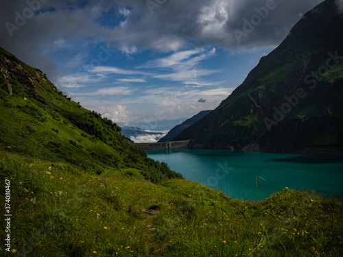 Scenic view on Wasserfallboden See near Kaprun, Austria, Europe. National park Hohe Tauern. Charming lake with amazing deep colorful water and wild clouds on sky.