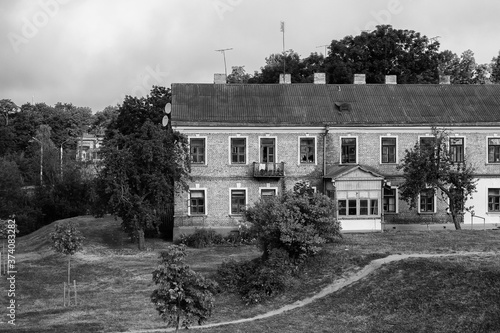 Fototapeta Naklejka Na Ścianę i Meble -  Grodno, Belarus. An old brick house located in a ravine. Black and white version.