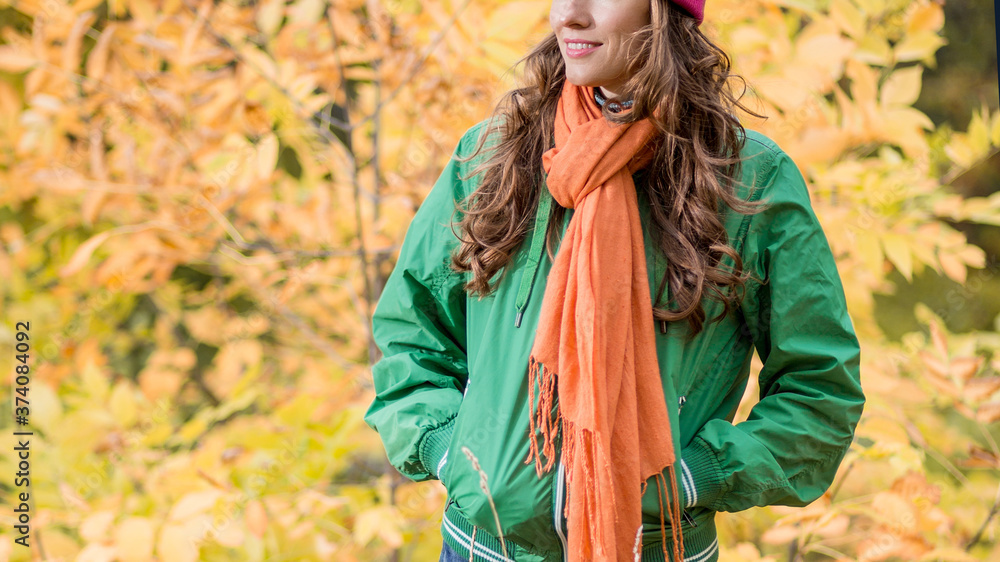 Carefree young woman in autumn park enjoying good warm weather Carefree young woman in autumn park enjoying good warm weather