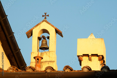 Italia, Toscana, Firenze, un piccolo campanile e comignolo. photo