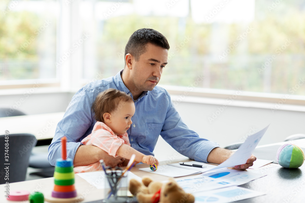 remote job, multi-tasking and family concept - middle-aged father with baby working at home office remote job, multi-tasking and family concept - middle-aged father with baby working at home office