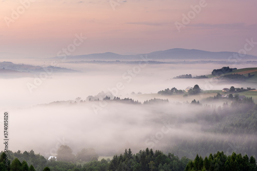 Panoramic View over Rolling Hills in Morning Fog at Sunrise. Lesser Poland.