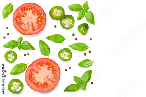 fresh tomato slices with green pepper and basil leaves isolated on white background. top view