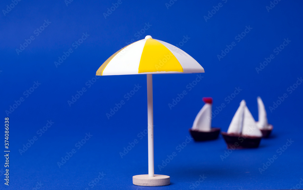 beach umbrella on the background of boats