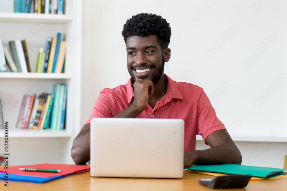 Smart afro american male student at computer Smart afro american male student at computer