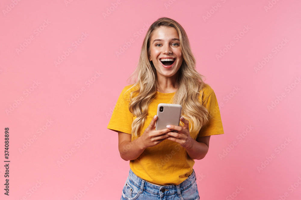 Positive young woman using mobile phone