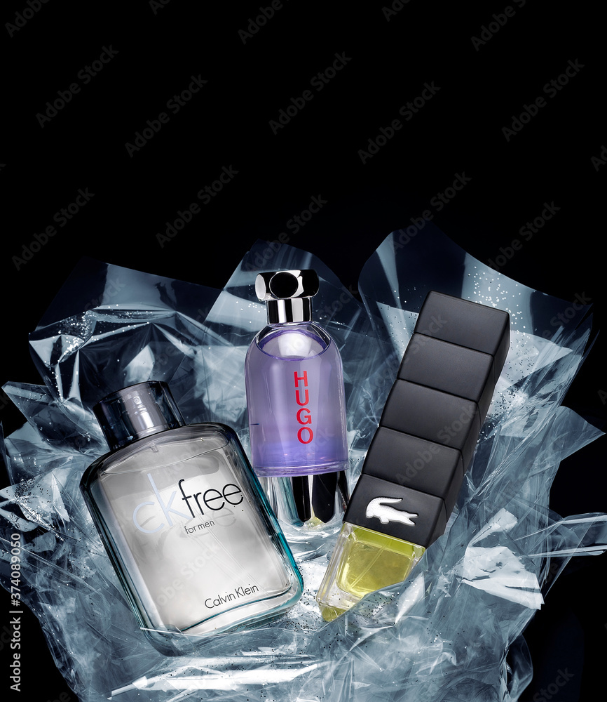 Barcelona- Spain- Circa October 2014- Three classic perfume bottles of distinguished brands for men. Calvin klein, Lacoste, and Hugo Boss setting in a gift package Stock Photo Adobe Stock