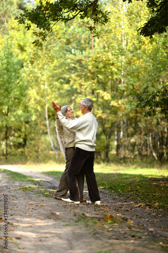 Senior couple dancing in autumn forest © aletia2011