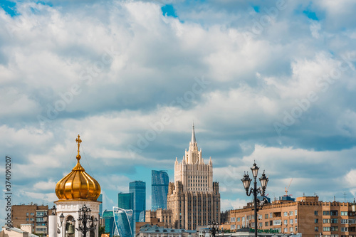 Panoramic view of the Church's Golden domes and skyscrapers in the business center in Moscow