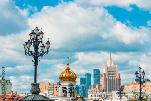 Panoramic view of the Church's Golden domes and skyscrapers in the business center in Moscow