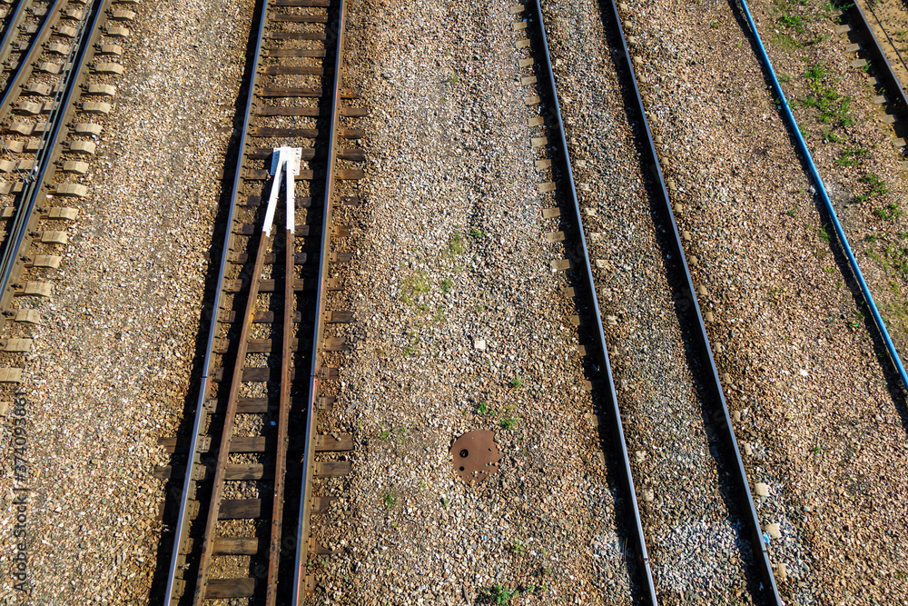 Top view of the railway rails. The space between the tracks is covered with rubble