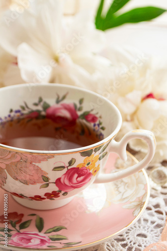 Tea time. Vintage cup of tea on a beautifully decorated table