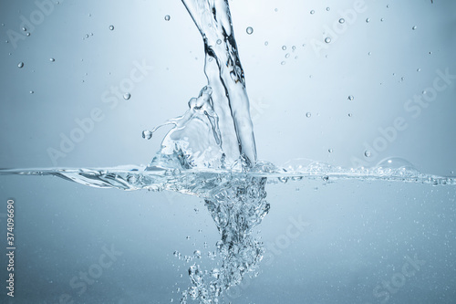 Water splash isolated. Close up of splash of water forming flower shape, isolated on white background.