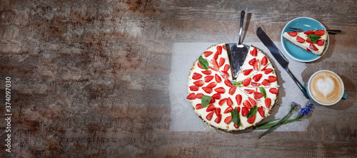 Fototapeta Naklejka Na Ścianę i Meble -  Delicious cheesecake with strawberries, bio homemade strawberries from garden, layout