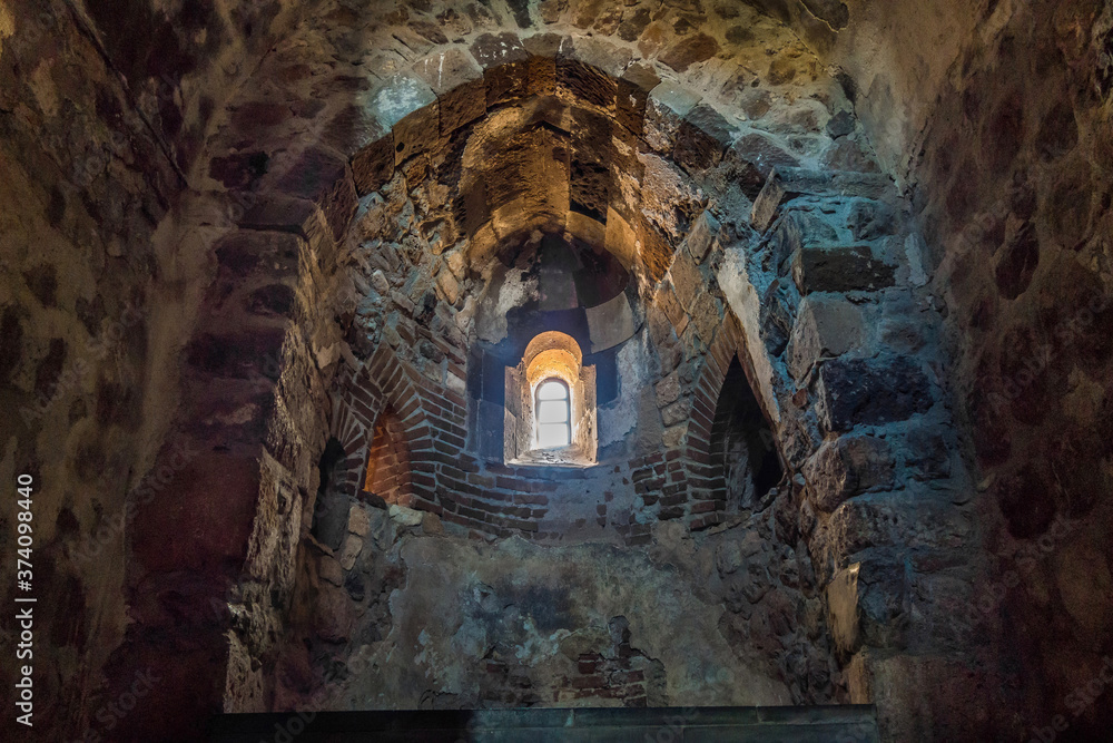 Massive wall with window inside of medieval Cathedral of Holy Cross, Akdamar Island, Gevaş, Turkey. Built in 921 & abandoned in 20 century, monastery is popular tourist destination in Van district