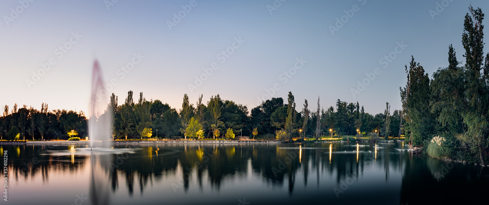 Naklejka premium Reflections on the park lake