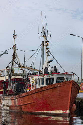 Old fishing trawler docked in Dingle harbour in county Kerry, Ireland