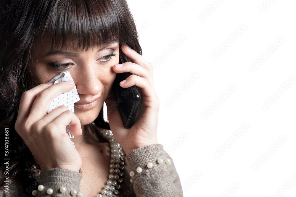 Young crying woman isolated on white background Young crying woman isolated on white background
