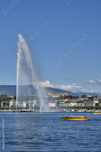 the water jet fountain and the famous yellow boats on, lake geneva, switzerland.