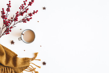 Autumn composition. Plaid, cup of coffee on white background. Autumn, winter concept. Flat lay, top view