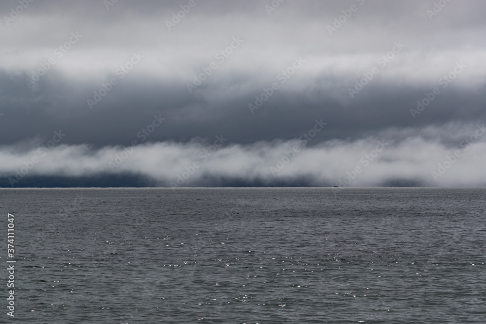 Fototapeta premium Morning mist layer and clouds over Altlantic ocean on the west coast of Ireland