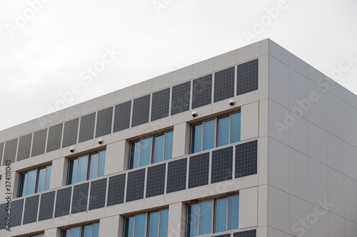 Building solar panels. Solar elementary school building. Eco-friendly school building.