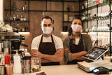 Coffee shop owners with face masks, lockdown, quarantine, coronavirus, back to normal concept