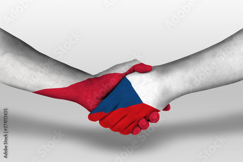 Handshake between czech republic and poland flags painted on hands, illustration with clipping path.