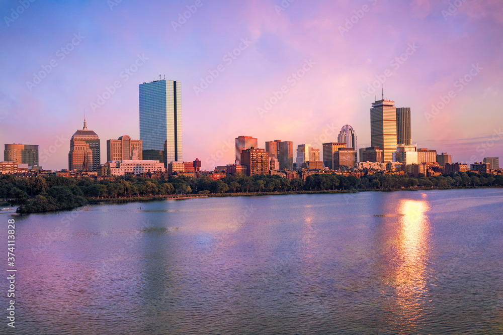 View of the Boston skyline from across the Charles River at dusk.