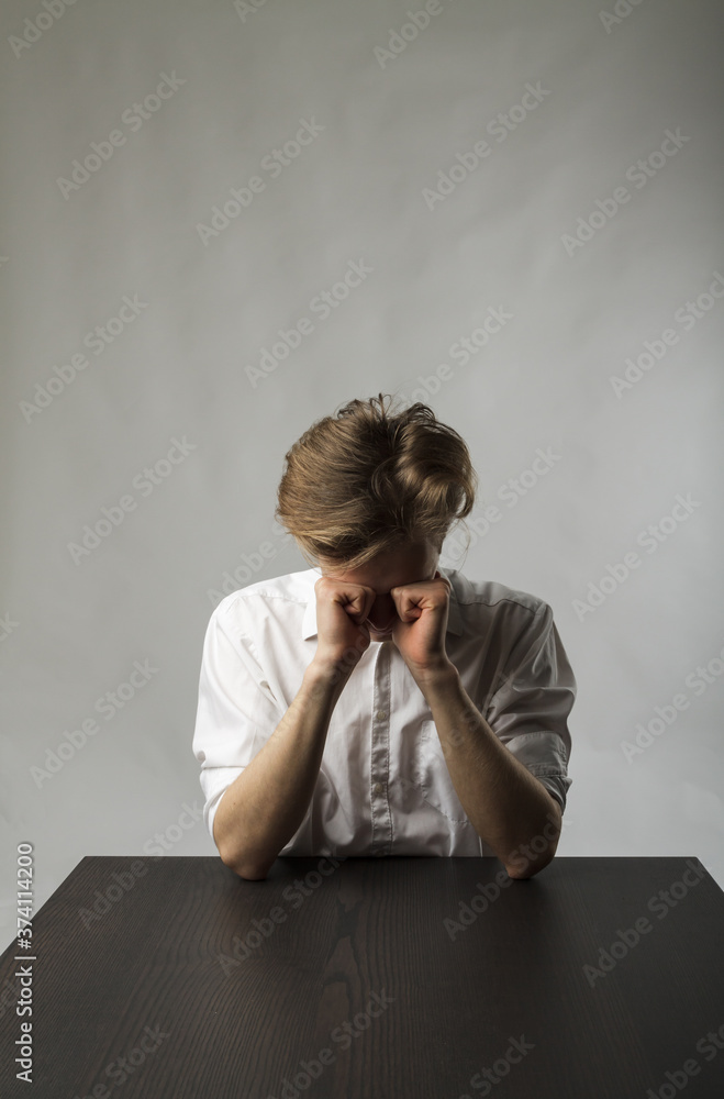 Tired young man. Overtime and fatigue concept. Tired young man. Overtime and fatigue concept.