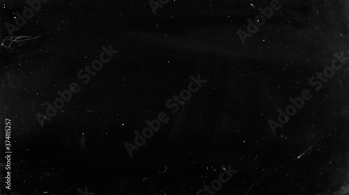 Fractured glass texture. Grunge effect. Black broken smartphone screen with white dirt dust.