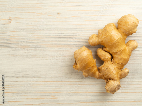 ginger on the table on the right, flat lay, copy space, horizontal orientation, beige, closeup