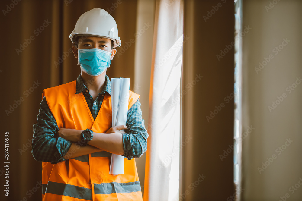 Portrait of industrial engineer man wears protective mask in office for prevention COVID-19 virus to stop spreading. Portrait of industrial engineer man wears protective mask in office for prevention COVID-19 virus to stop spreading.