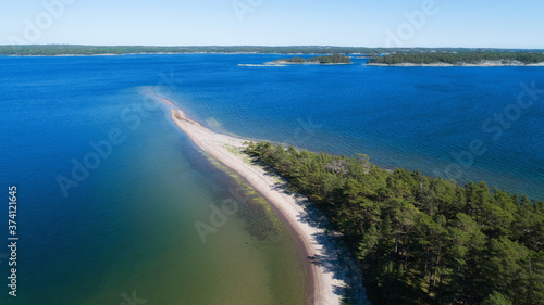 Aerial view of Baltic Sea.Summer seascape, beach, beautiful waves, blue water at sunset. Top view from drone.