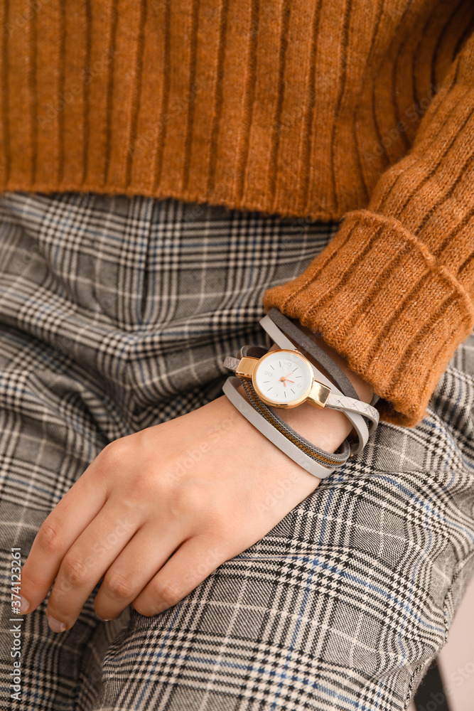 Woman with stylish wrist watch, closeup