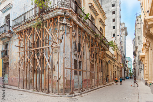 Havana, Cuba-October 08, 2016. Residential house of Spanish colonial times in historical part at Old Havana city on the street with local people at every day life on October 08, 2016.