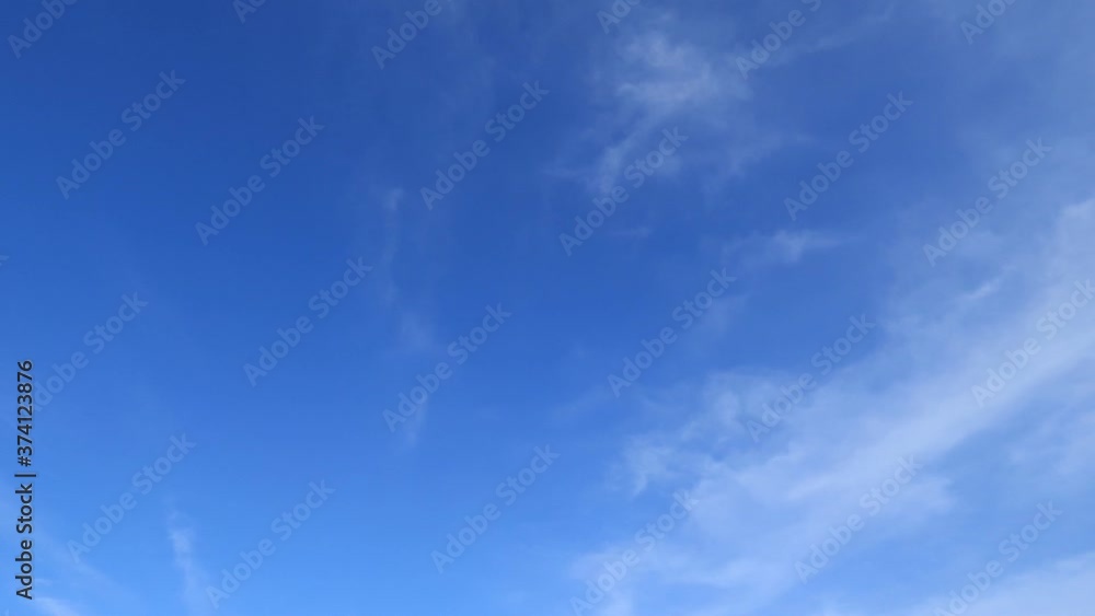 B-roll TimeLapse of sunny clear blue sky with white cirrus or cirrostratus clouds & cumulus or cirrocumulus cloudscape on beautiful daylight horizon in tropical summer or spring sunlight & sun rays B-roll TimeLapse of sunny clear blue sky with white cirrus or cirrostratus clouds & cumulus or cirrocumulus cloudscape on beautiful daylight horizon in tropical summer or spring sunlight & sun rays