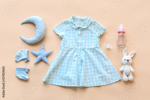 Baby clothes with bottle, p...