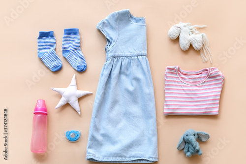 Baby clothes with bottle, p...