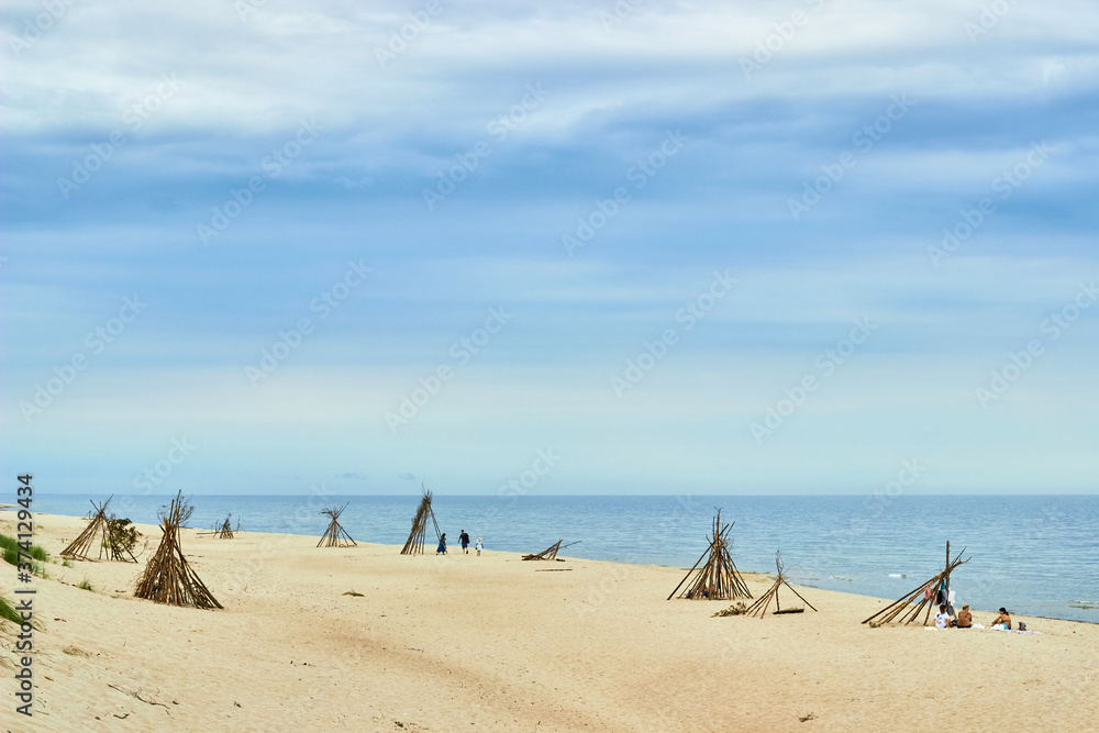 Curonian Spit, Russia - August 21, 2020. People rest with families Curonian Spit, Russia - August 21, 2020. People rest with families