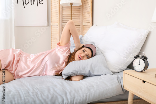 Stressed woman with alarm c...