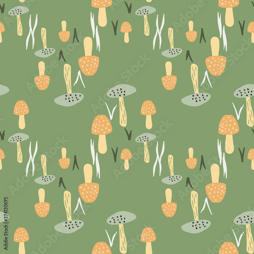 Autumn stylized seamless pattern with mushrooms. Green background with orange nature wild fungus elements.
