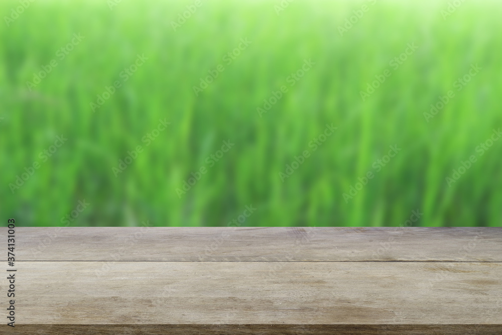 Perspective brown wooden board empty table in front of paddy field. Perspective brown wooden board empty table in front of paddy field.