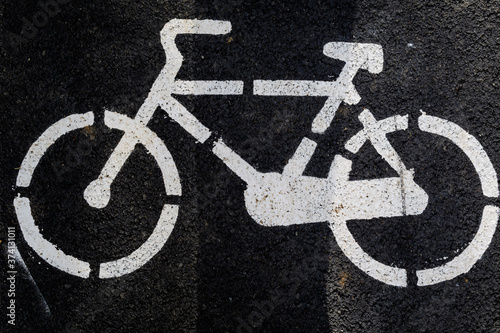 Outdoor road sign indicating dedicated route for bicycles in a large city.