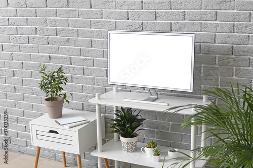 Modern TV set on stand near...