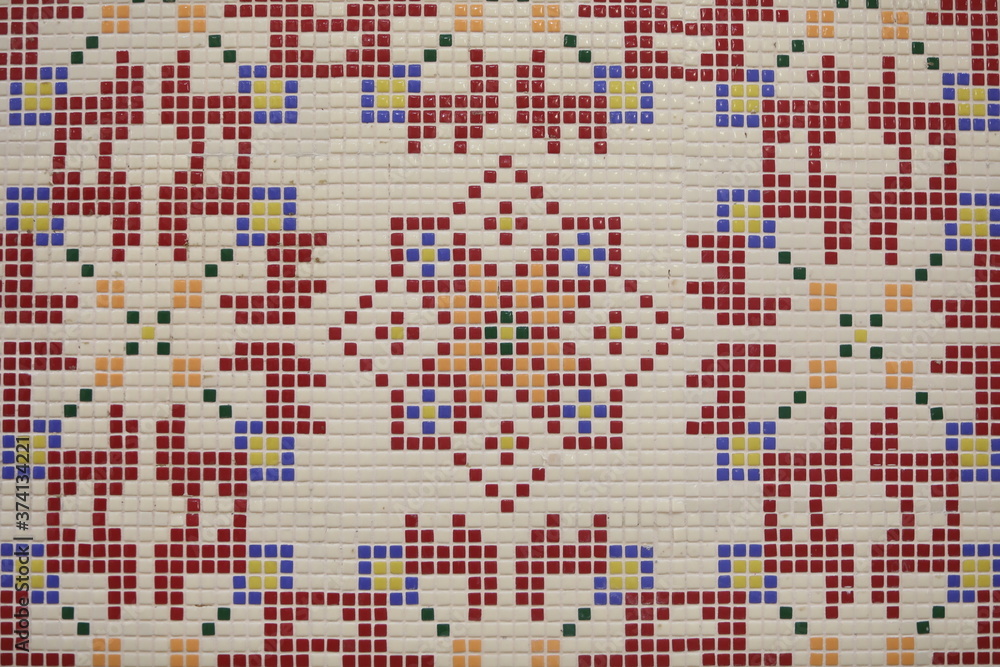 Fototapeta premium Checkered traditional Bulgarian ceramic mosaic tile background pattern. Architectural mosaic detail, abstract background for street, bath and pool. Ornamental pattern for street and interior design