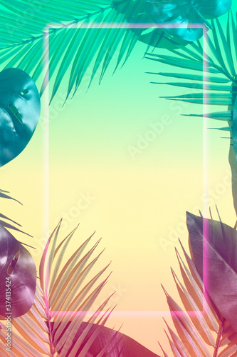 Creative color layout made of tropical leaves in neon colors . Flat lay. Nature art concept. copy space