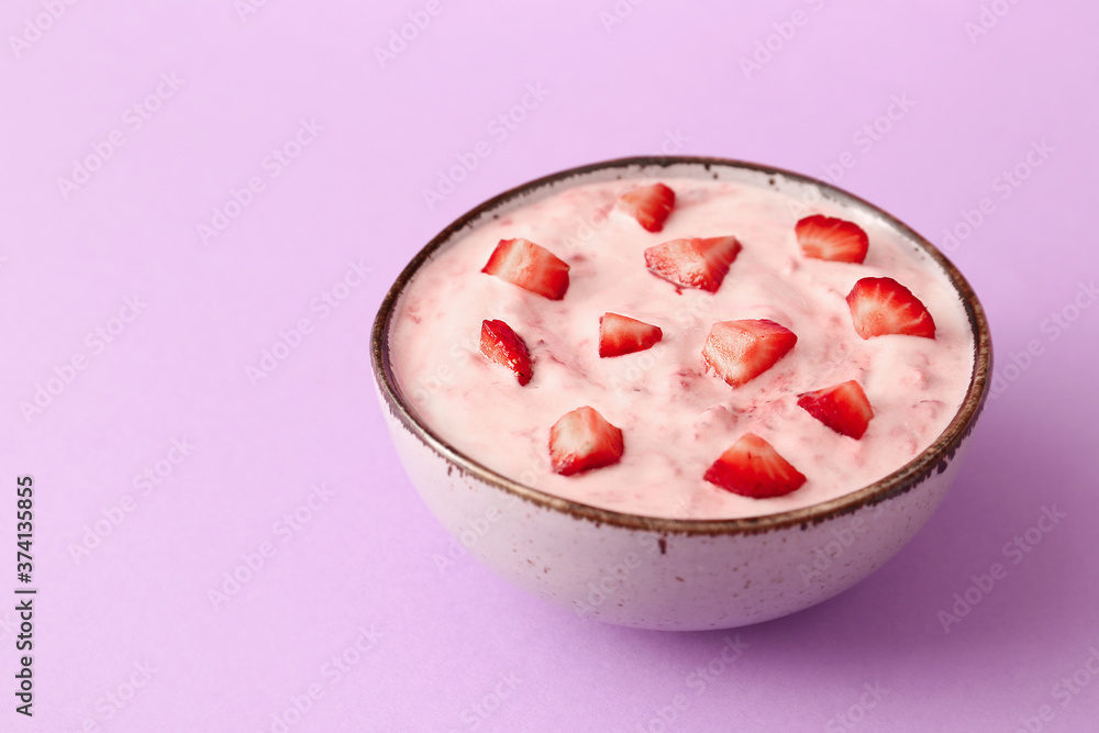 Bowl of strawberry yogurt on color background Bowl of strawberry yogurt on color background