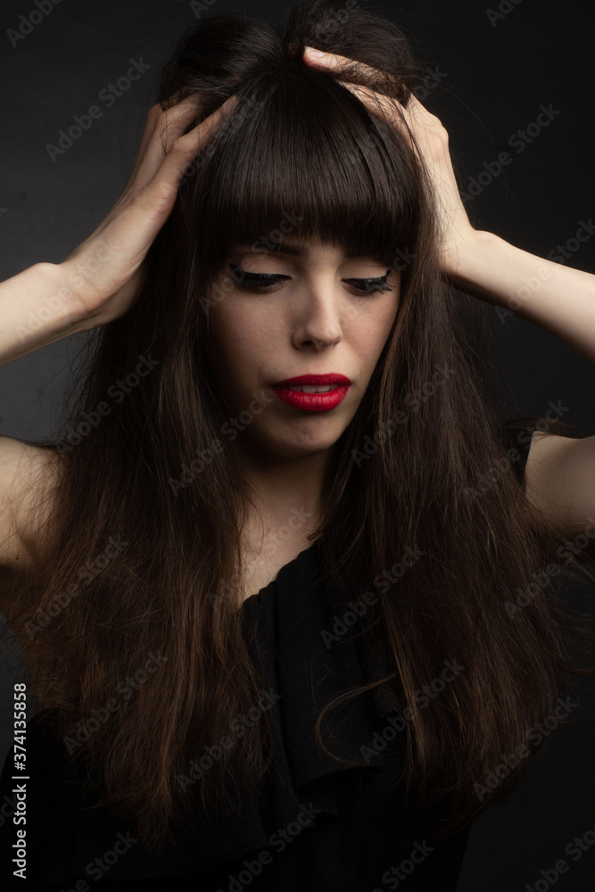 portrait of brunette with long hair off shoulder. portrait of brunette with long hair off shoulder.